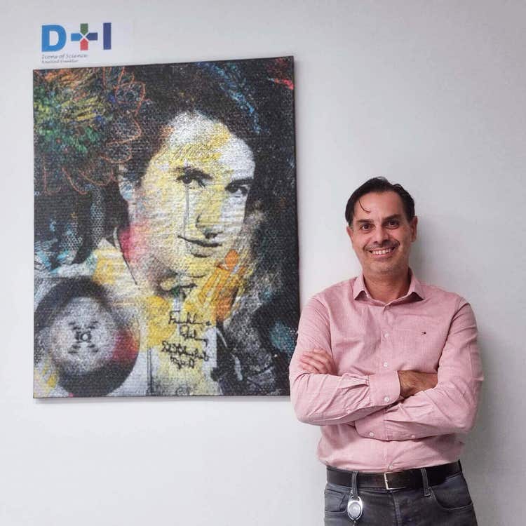 Daniele Tortorella standing with Rosalind Franklin picture